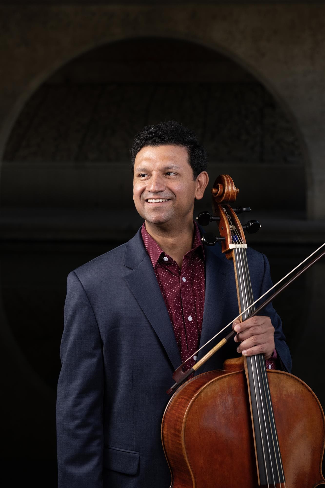 Ismar Gomes with his cello and bow.